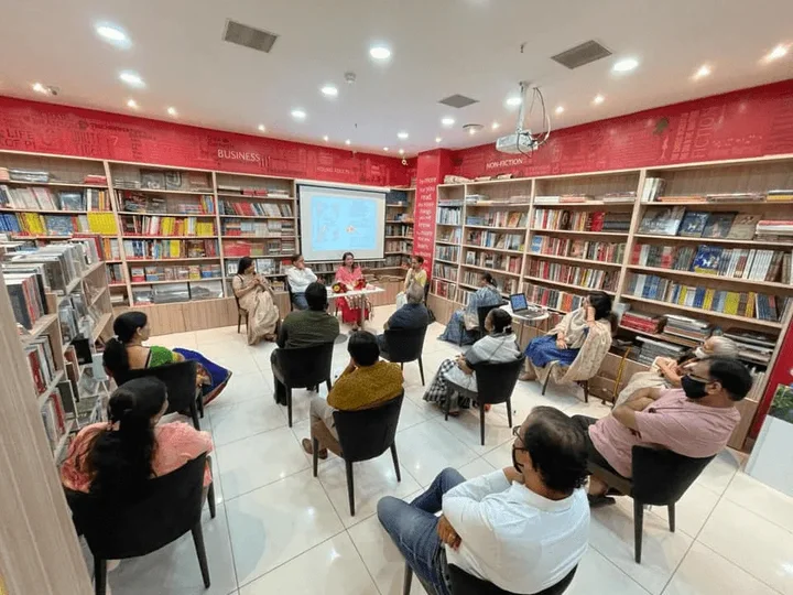 Audience seated for a literary gathering in a bookshop
