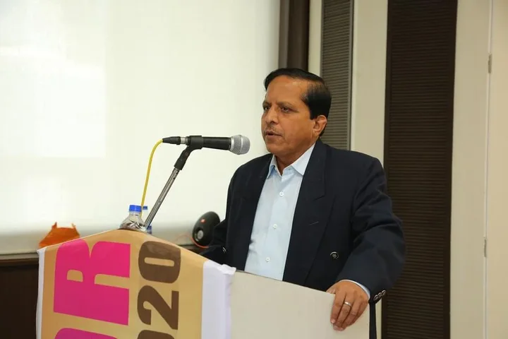 Pradeep Biswal speaking at a lectern