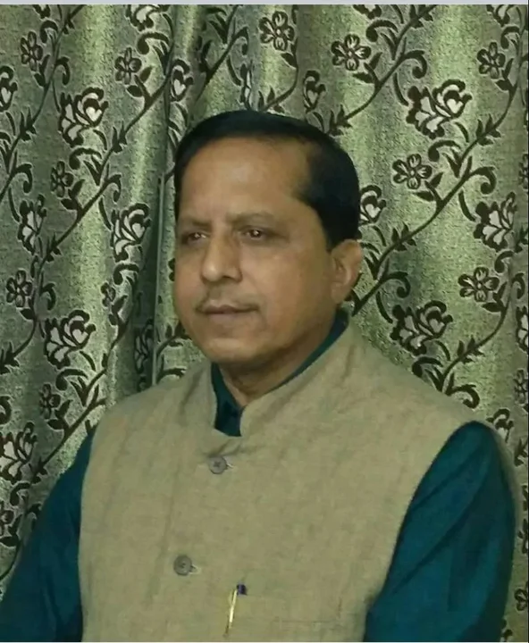 Portrait of Pradeep Biswal wearing a beige waistcoat