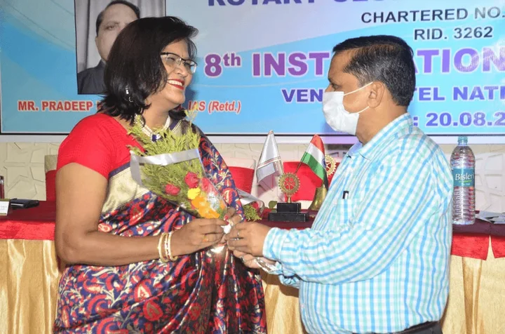 Bouquet presentation at a Rotary event